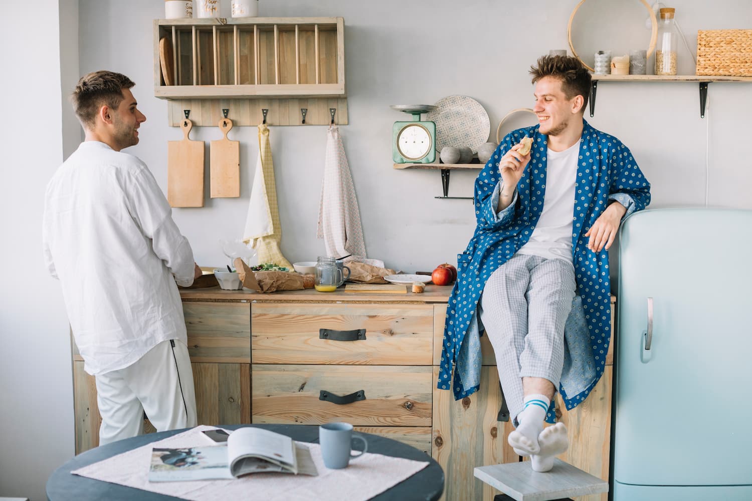 Friends eating food in a kitchen